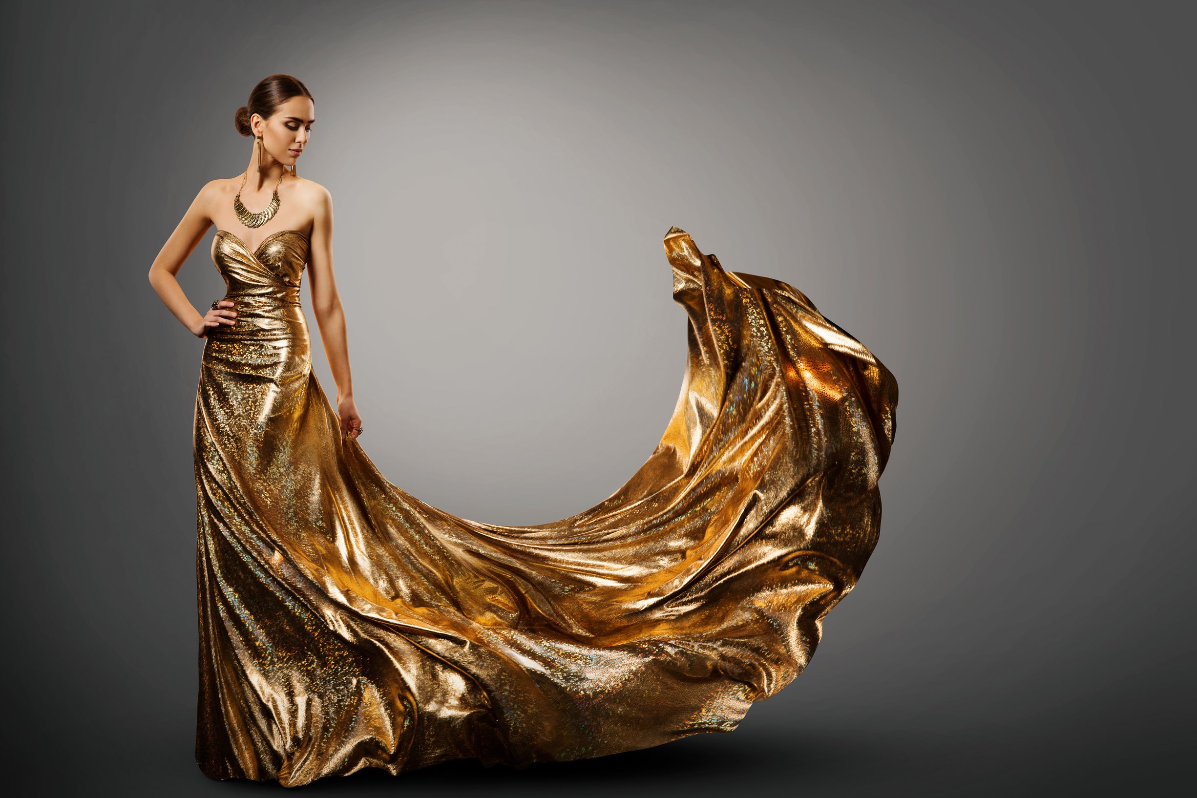 Woman Gold Dress, Fashion Model in Long Waving Fluttering Gown, Young Girl Beauty Portrait